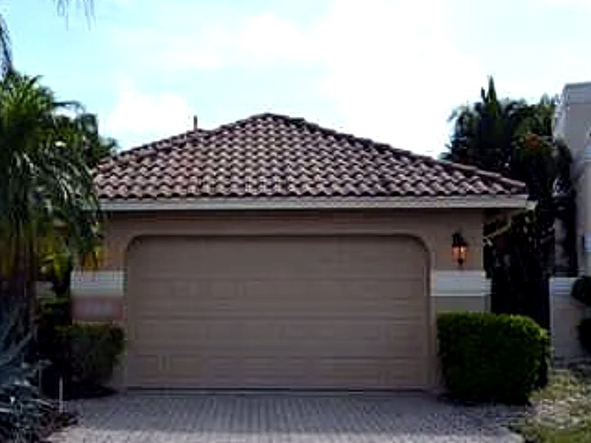 Single-story stucco home with tile roof before the second-story addition